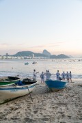 Group of people paying homage to Yemanja at sunrise at the Z-13 fishing colony at Post 6 on Copacabana Beach - Rio de Janeiro city - Rio de Janeiro state (RJ) - Brazil