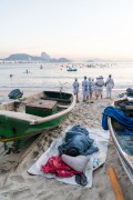 Group of people paying homage to Yemanja at sunrise at the Z-13 fishing colony at Post 6 on Copacabana Beach - Rio de Janeiro city - Rio de Janeiro state (RJ) - Brazil