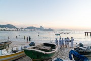 Group of people paying homage to Yemanja at sunrise at the Z-13 fishing colony at Post 6 on Copacabana Beach - Rio de Janeiro city - Rio de Janeiro state (RJ) - Brazil