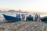 Group of people paying homage to Yemanja at sunrise at the Z-13 fishing colony at Post 6 on Copacabana Beach - Rio de Janeiro city - Rio de Janeiro state (RJ) - Brazil