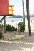 Homeless man sleeping on the sand of Copacabana Beach under a lifeguard booth - Rio de Janeiro city - Rio de Janeiro state (RJ) - Brazil