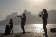 Musician on Arpoador Rock with Two brothers Mountain and Rock of Gavea in the background - Rio de Janeiro city - Rio de Janeiro state (RJ) - Brazil