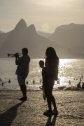 Musician on Arpoador Rock with Two brothers Mountain in the background - Rio de Janeiro city - Rio de Janeiro state (RJ) - Brazil