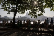 People socializing and drinking sitting by the sea in Short wall of Urca - Rio de Janeiro city - Rio de Janeiro state (RJ) - Brazil