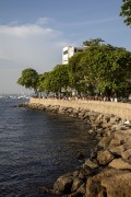 People socializing and drinking sitting by the sea in Short wall of Urca - Rio de Janeiro city - Rio de Janeiro state (RJ) - Brazil