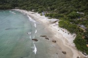 Picture taken with drone of Aventureiro Beach with a small fishing village - Angra dos Reis city - Rio de Janeiro state (RJ) - Brazil