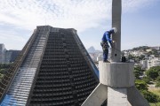 Picture taken with drone of a man performing maintenance on the bell tower of the Cathedral of Sao Sebastiao do Rio de Janeiro (1979) - Rio de Janeiro city - Rio de Janeiro state (RJ) - Brazil