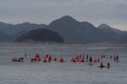 Practitioners of Stand up paddle watching the sunrise - post 6 of Copacabana Beach - Rio de Janeiro city - Rio de Janeiro state (RJ) - Brazil