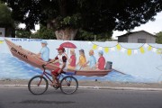 Street with wall painted with regional themes in the city of Parintins - Parintins city - Amazonas state (AM) - Brazil