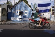 House painted with the colors of Boi Caprichoso in the city of Parintins - Parintins city - Amazonas state (AM) - Brazil
