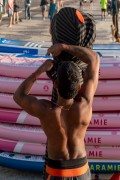Man packing stand-up paddleboard paddles at Posto 6 on Copacabana Beach - Rio de Janeiro city - Rio de Janeiro state (RJ) - Brazil