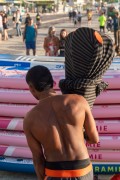 Man packing stand-up paddleboard paddles at Posto 6 on Copacabana Beach - Rio de Janeiro city - Rio de Janeiro state (RJ) - Brazil