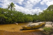 Small fishing boat at river mouth - Imbassuaba Beach - Prado city - Bahia state (BA) - Brazil