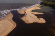 Picture taken with drone of river mouth at Barra do Cahy Beach - Prado city - Bahia state (BA) - Brazil