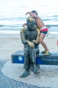 Child playing at the statue of the poet Carlos Drummond de Andrade on Copacabana Beach - Rio de Janeiro city - Rio de Janeiro state (RJ) - Brazil