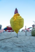 Closed sun umbrella in the form of a display with beach products inside - Rio de Janeiro city - Rio de Janeiro state (RJ) - Brazil