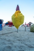 Closed sun umbrella in the form of a display with beach products inside - Rio de Janeiro city - Rio de Janeiro state (RJ) - Brazil