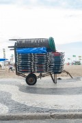 Detail of cargo trolley - man carrying a cart - with beach chairs - Copacabana Beach waterfront - Rio de Janeiro city - Rio de Janeiro state (RJ) - Brazil