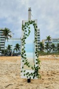 Mirror decorated with plastic flowers on the edge of Ipanema Beach - Rio de Janeiro city - Rio de Janeiro state (RJ) - Brazil