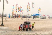 Men pushing cargo trolley - man carrying a cart - with beach chairs - Copacabana Beach waterfront - Rio de Janeiro city - Rio de Janeiro state (RJ) - Brazil