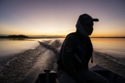 Man boating during sunrise - Mamiraua Sustainable Development Reserve - Alvaraes city - Amazonas state (AM) - Brazil