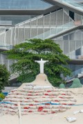 Sand sculpture by artist Rogean Rodrigues representing Christ the Redeemer with the Museum of Image and Sound in the background - Copacabana Beach - Rio de Janeiro city - Rio de Janeiro state (RJ) - Brazil