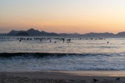 Practitioners of Stand up paddle watching the sunrise - post 6 of Copacabana Beach - Rio de Janeiro city - Rio de Janeiro state (RJ) - Brazil