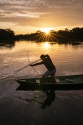 Indigenous fishing with bow and arrow at sunrise - Mamiraua Sustainable Development Reserve - Alvaraes city - Amazonas state (AM) - Brazil
