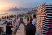 Woman using a smartphone - Arpoador beach with beach chair for rent - Rio de Janeiro city - Rio de Janeiro state (RJ) - Brazil