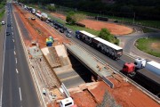 Picture taken with drone of men working on the construction of the third lane on an overpass of the Washington Luis Highway (SP-310) - Mirassol city - Sao Paulo state (SP) - Brazil