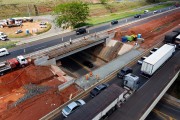 Picture taken with drone of men working on the construction of the third lane on an overpass of the Washington Luis Highway (SP-310) - Mirassol city - Sao Paulo state (SP) - Brazil