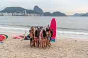 Practitioners of Stand up paddle fraternizing - post 6 of Copacabana Beach with the Sugar Loaf in the background - Rio de Janeiro city - Rio de Janeiro state (RJ) - Brazil