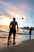 Bathers playing soccer - Arpoador Beach waterfront with the Morro Dois Irmaos (Two Brothers Mountain) in the background - Rio de Janeiro city - Rio de Janeiro state (RJ) - Brazil
