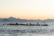 Practitioners of Stand up paddle watching the sunrise - post 6 of Copacabana Beach - Rio de Janeiro city - Rio de Janeiro state (RJ) - Brazil